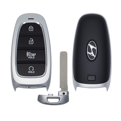 Car key fob with four black buttons (lock, unlock, hold) and a separate metal key blade next to the shell pieces, on a white background