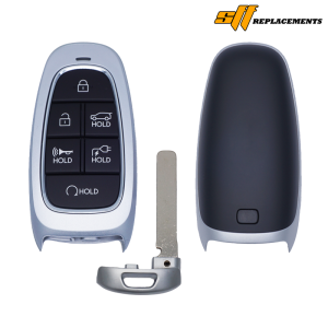 Car key fob with four buttons and a separate metal key blade and shell pieces