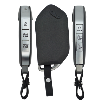 Set of three car key fobs with silver buttons (lock, unlock, hold/trunk) arranged around a black protective sleeve with a leather strap.