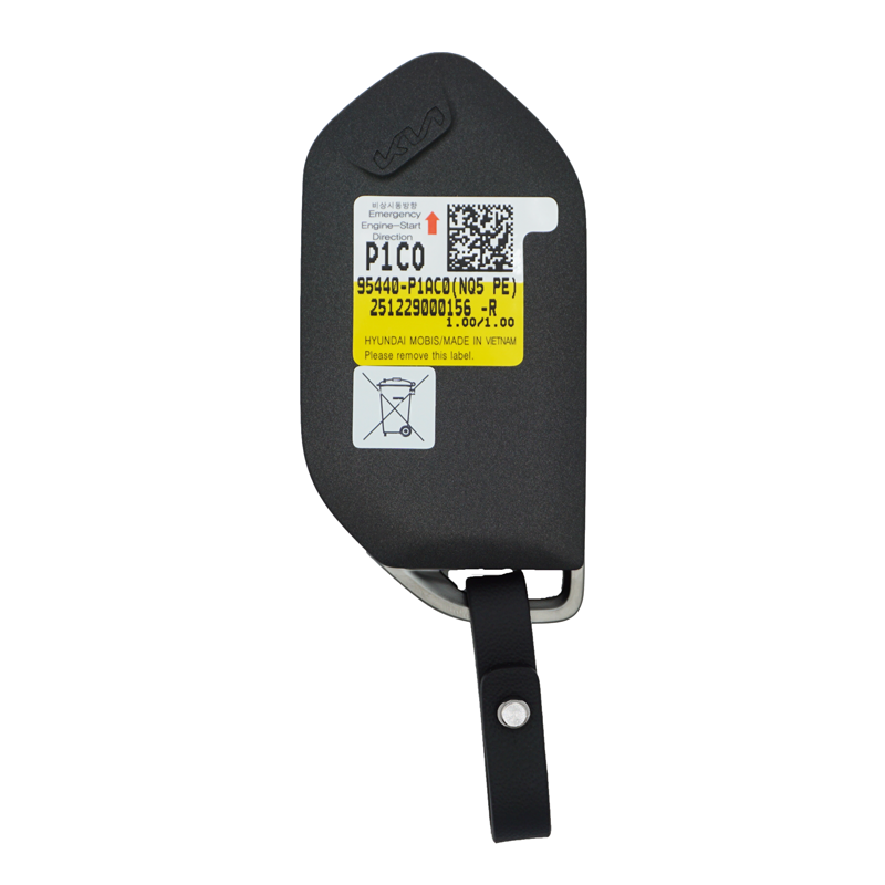 11935FS-SF-back - SFFobs Inc. Car key fob with a black case and an attached strap, featuring a yellow label on the front. (Informative)