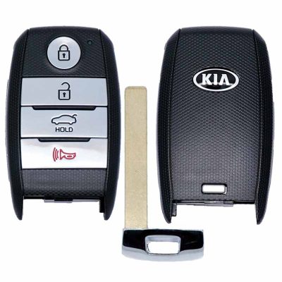 Kia car key fob with four silver buttons (lock, unlock, trunk hold, alarm) and a separate metal key blade laid beside it