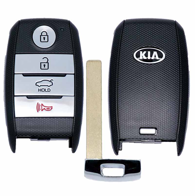 Kia car key fob with four silver buttons (lock, unlock, trunk hold, alarm) and a separate metal key blade laid beside it