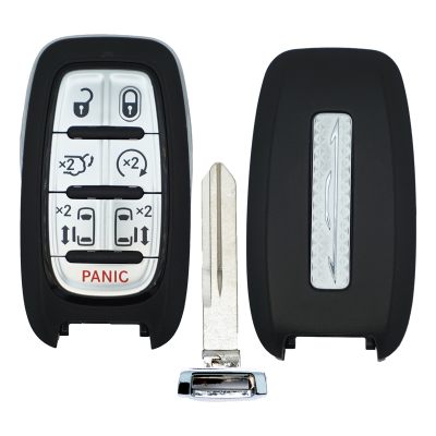 Car key fob with black casing, showing panic button and lock/unlock buttons, separated from its metal key blade.