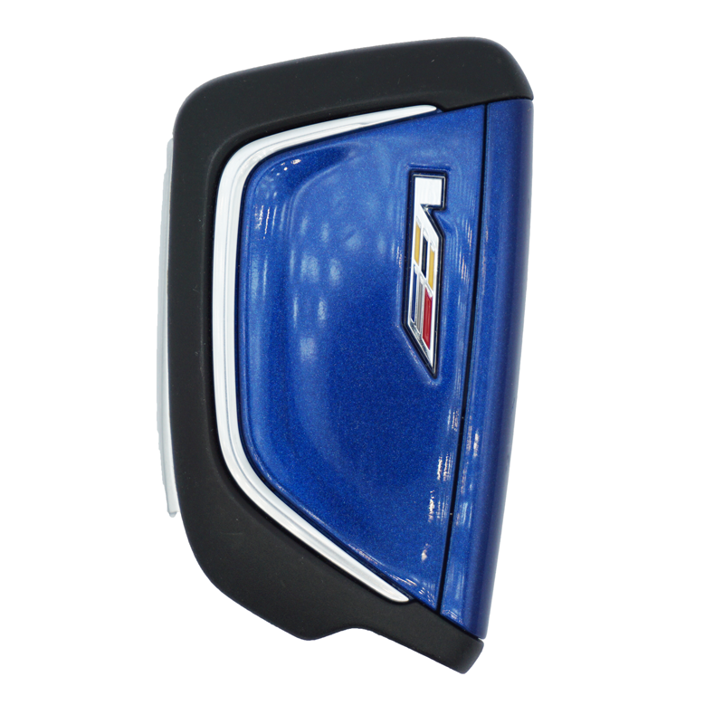 Close-up of a blue Cadillac key fob with a black protective frame/sleeve.