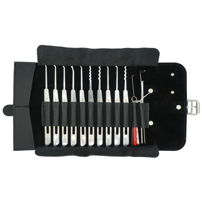 Manicure set in a black case with multiple stainless steel nail tools and cuticle pushers arranged in rows