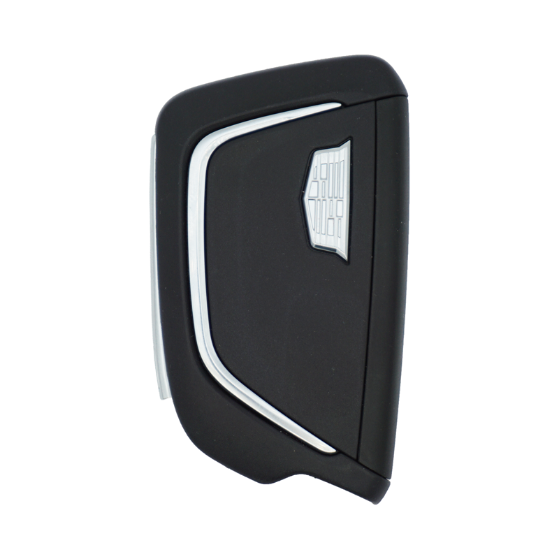 Black car key fob with silver trim and a small button, shown from the side/angled view