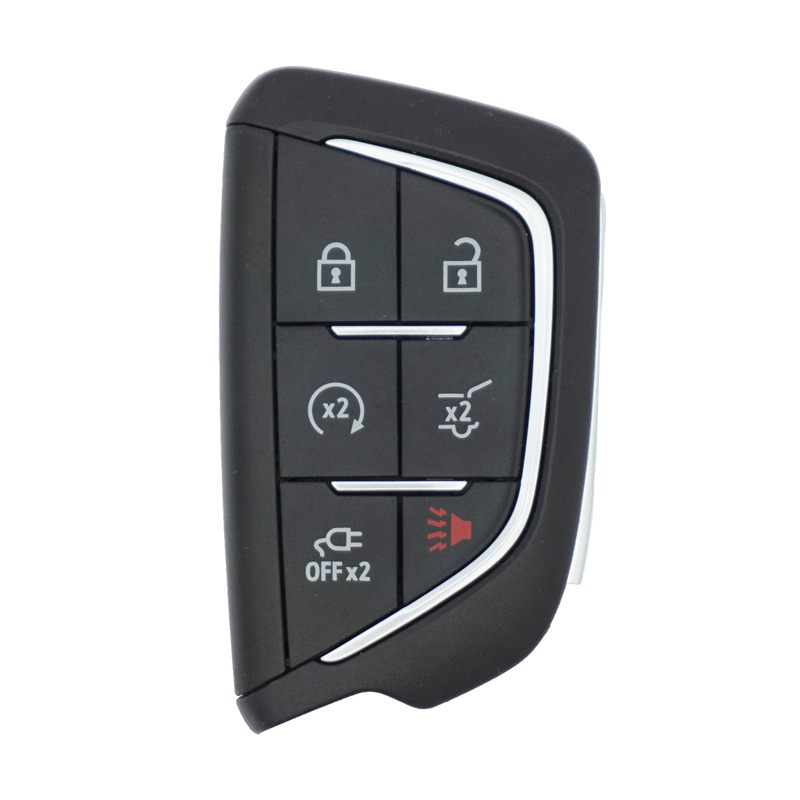 Black car key fob with lock, unlock, remote start, trunk release, and alarm buttons on a curved silver trim panel.