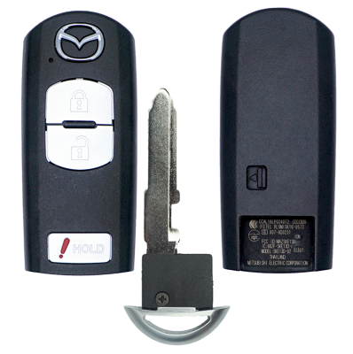 Mazda car key fob with two white buttons (lock and unlock) and a hold/panic button, plus the detached metal key blade seen beside it