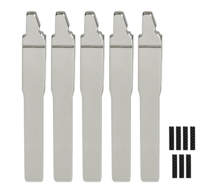 Five silver, blade-like metal tools lined up in a row with small black pieces to the right.