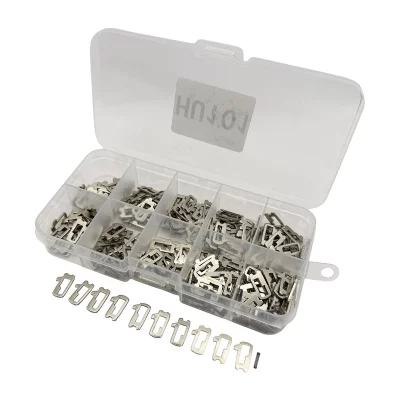 Transparent plastic tackle/organizer box with multiple small metal crimp terminals in each compartment; several loose terminals lined up in front