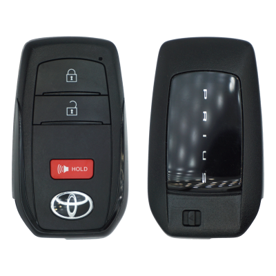 Pair of car key fobs: left fob with Toyota logo, two lock/unlock buttons and red HOLD button; right fob is a smart key with a vertical gear indicator display.